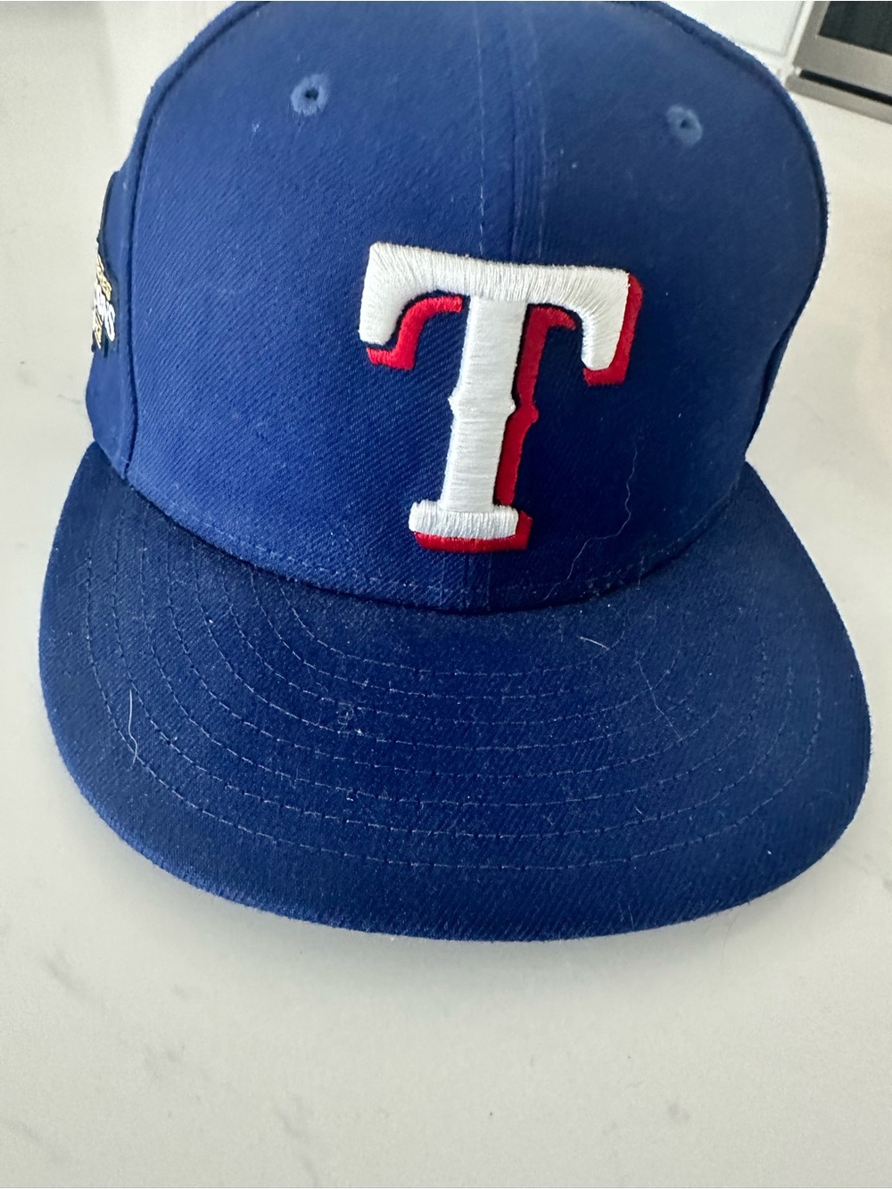 New Era Royal Blue Texas T Logo Cap with White and Red Embroidery fitted 7 1/4
